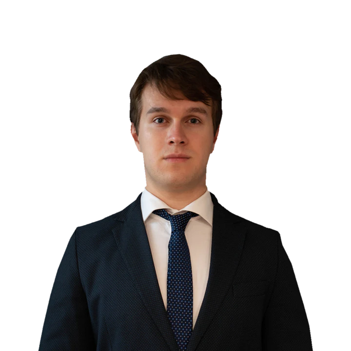Portrait of Lucian Dorin Crainic wearing a dark suit and tie